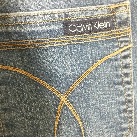 Calvin Klein medium wash mid-rise bootcut women's jeans. 12. - Picture 8 of 12